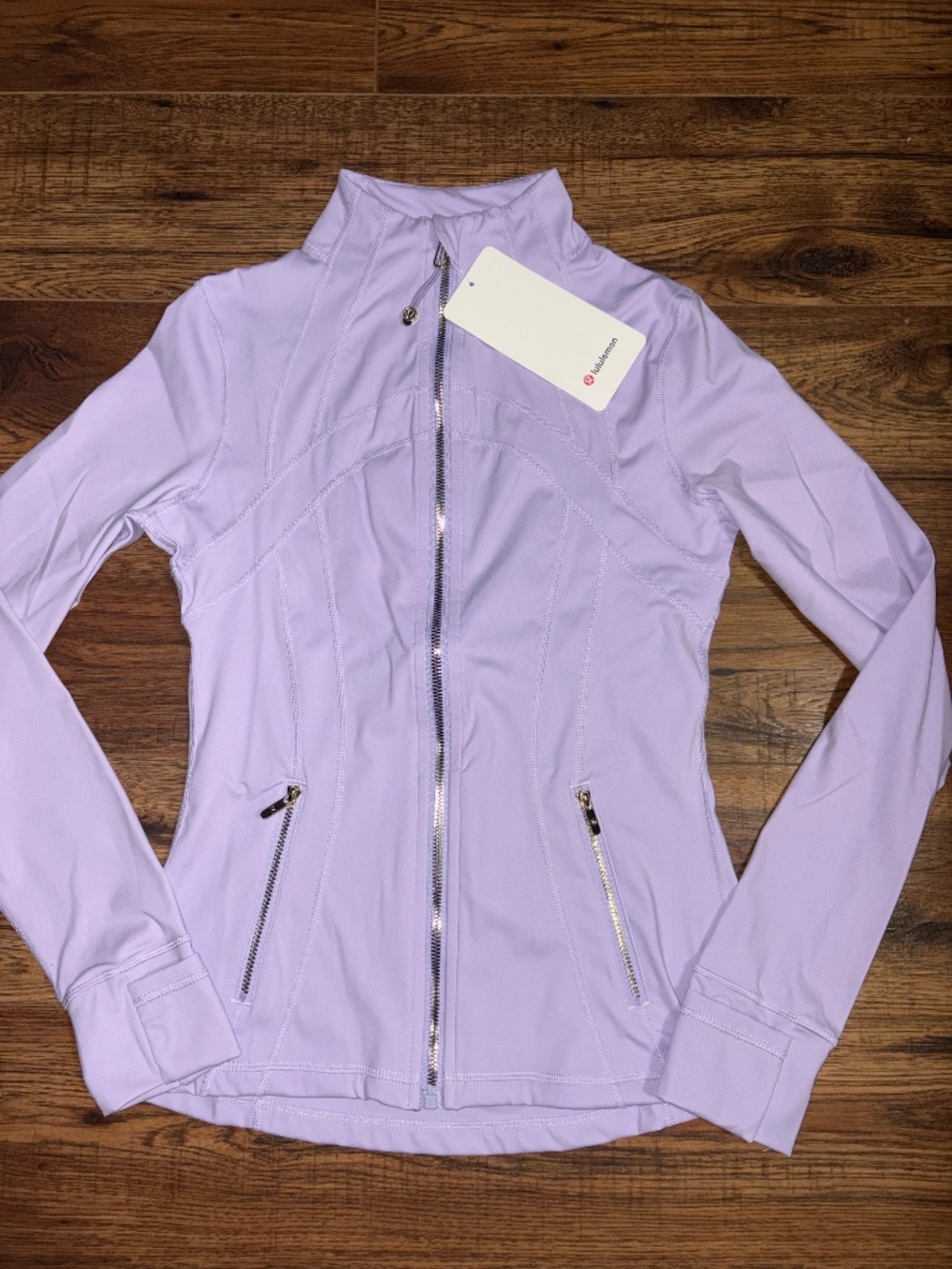 lulu define jacket Size 4 Lilac with Golden zippers.